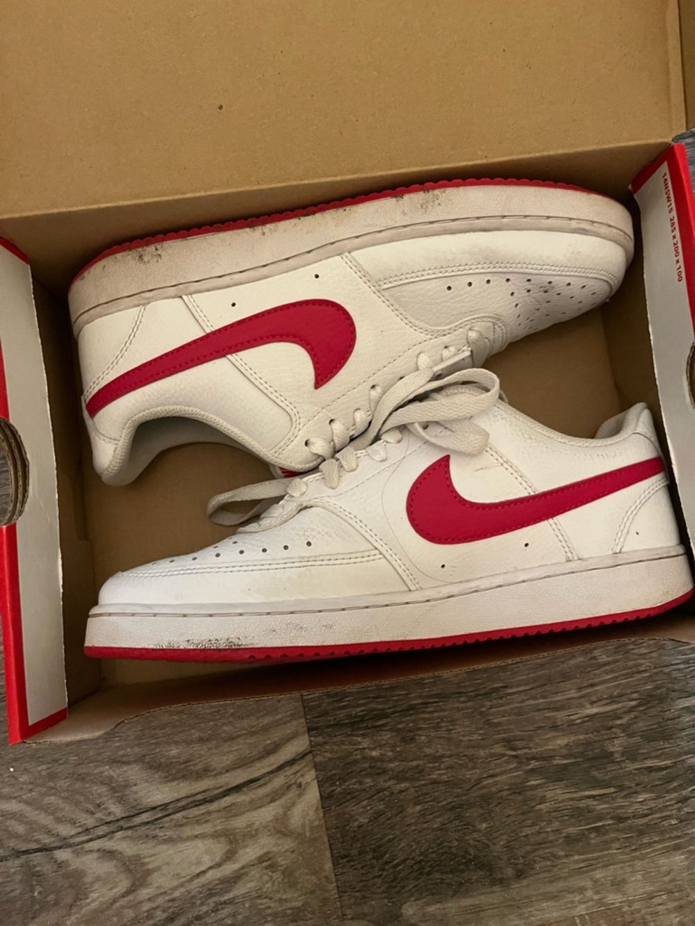 Nike White Sneakers with Red Swoosh and Red Outsole
